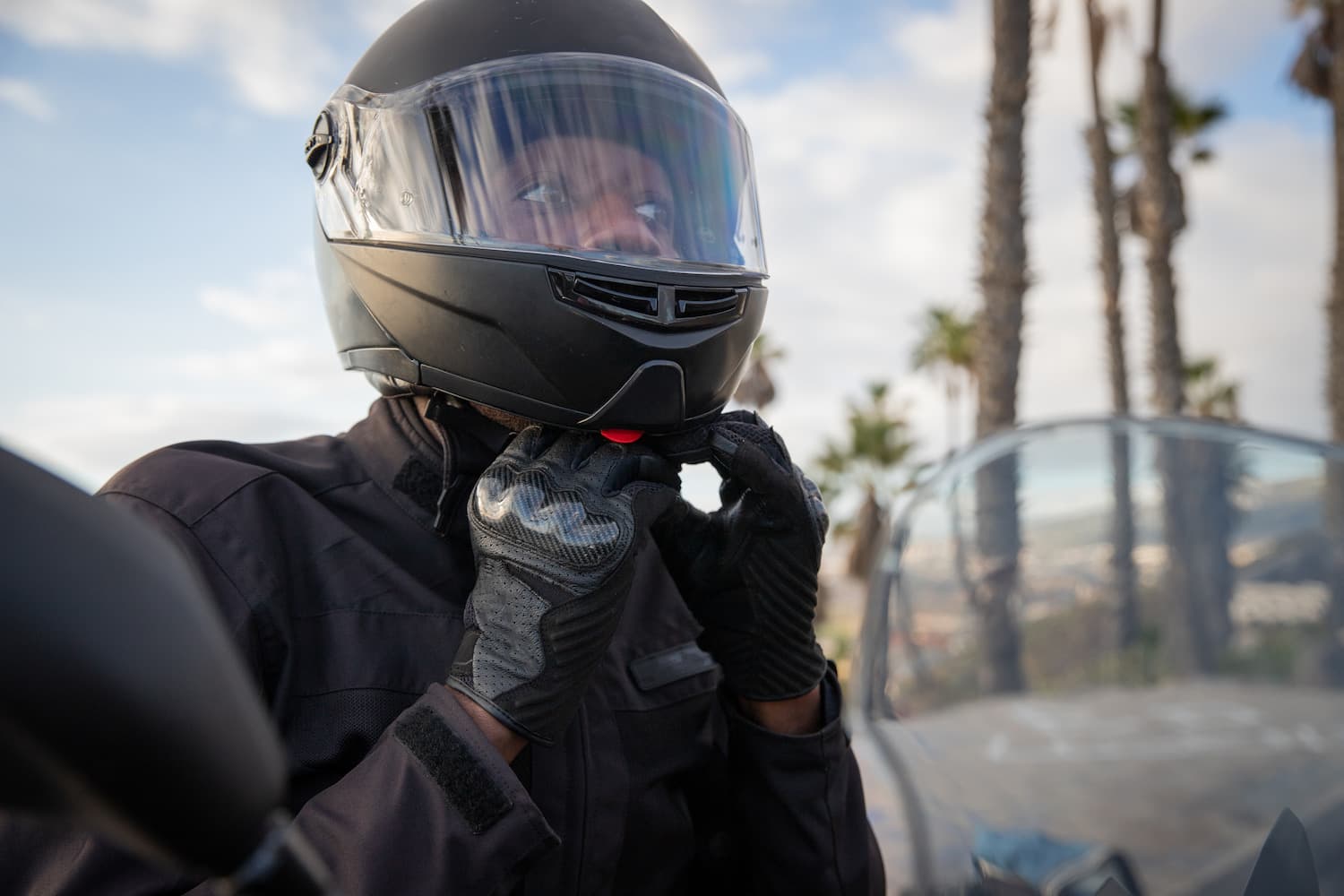 Person putting on motorcycle gear
